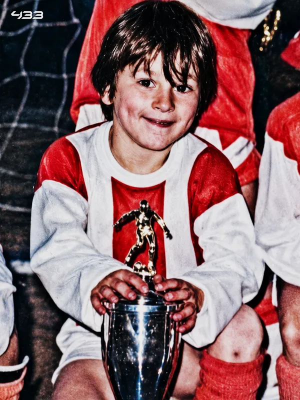 Lionel Messi holding the World Cup trophy